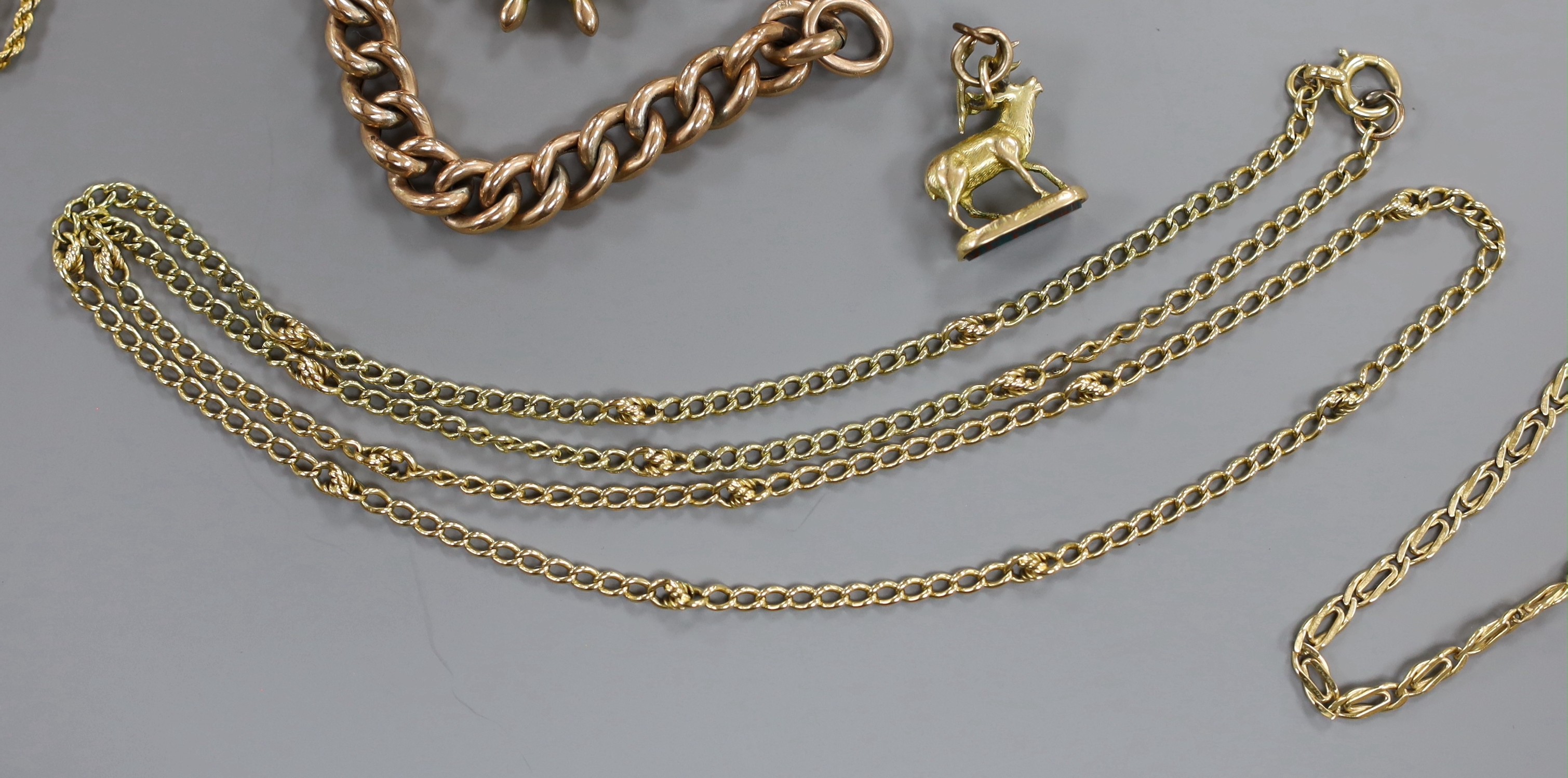 A 9ct hollow curb link rose gold bracelet with heart shaped padlock clasp, 14.6 grams, a 9ct rope twist chain, 7.8 grams, a yellow metal chain stamped 18, 21.1 grams, one other yellow metal chain stamped 750, 12 grams an